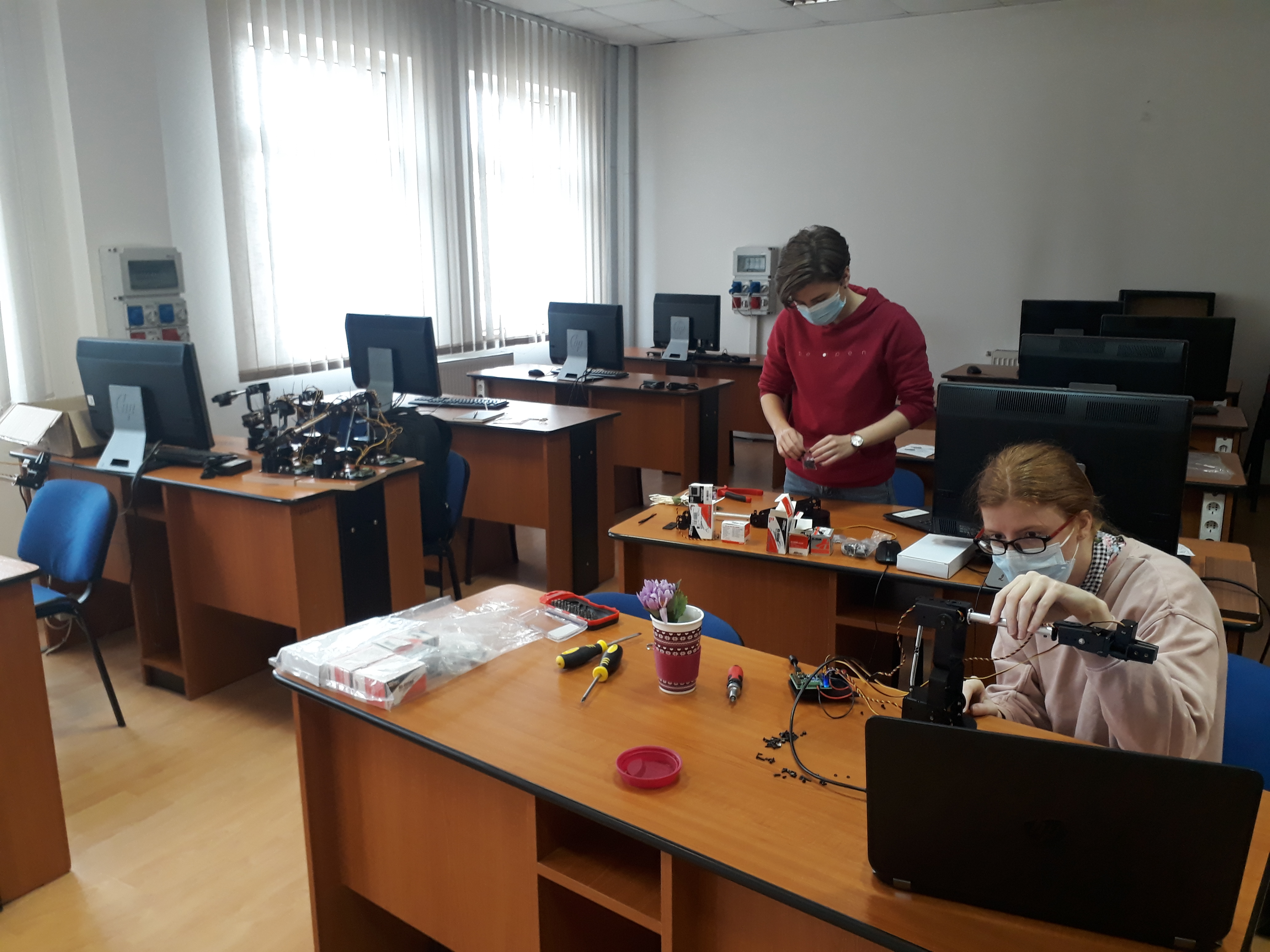 Ioana and Anna helping with the assemblying of the robots